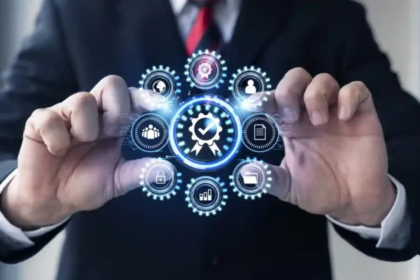 A imagem mostra um homem de terno segurando um painel holográfico com diversos ícones e engrenagens, sugerindo um sistema de gerenciamento empresarial integrado. O artigo abordará soluções para empresas que precisam gerenciar múltiplos CNPJs de forma centralizada, oferecendo recursos como controle de fluxos de trabalho, análises de desempenho e automação de processos em um único lugar. O foco do artigo parece ser apresentar uma plataforma ou software que permita a gestão eficiente de uma estrutura multiempresa.
